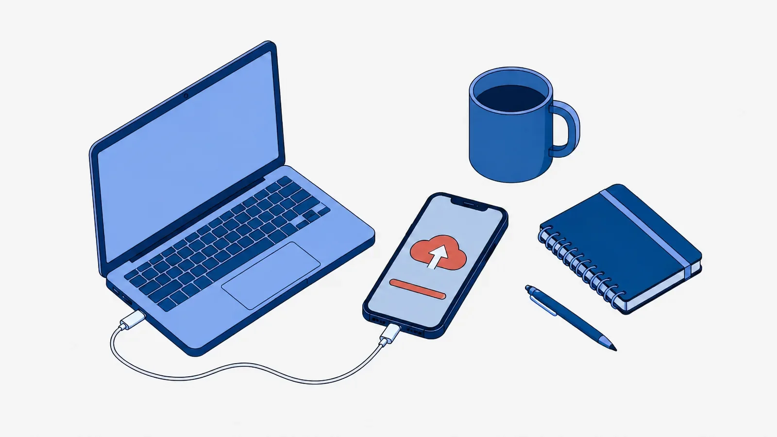 Smartfon z koralową ikoną chmury ze strzałką w górę i koralowym paskiem na ekranie, podłączony kablem do laptopa, obok kubek, notes i długopis