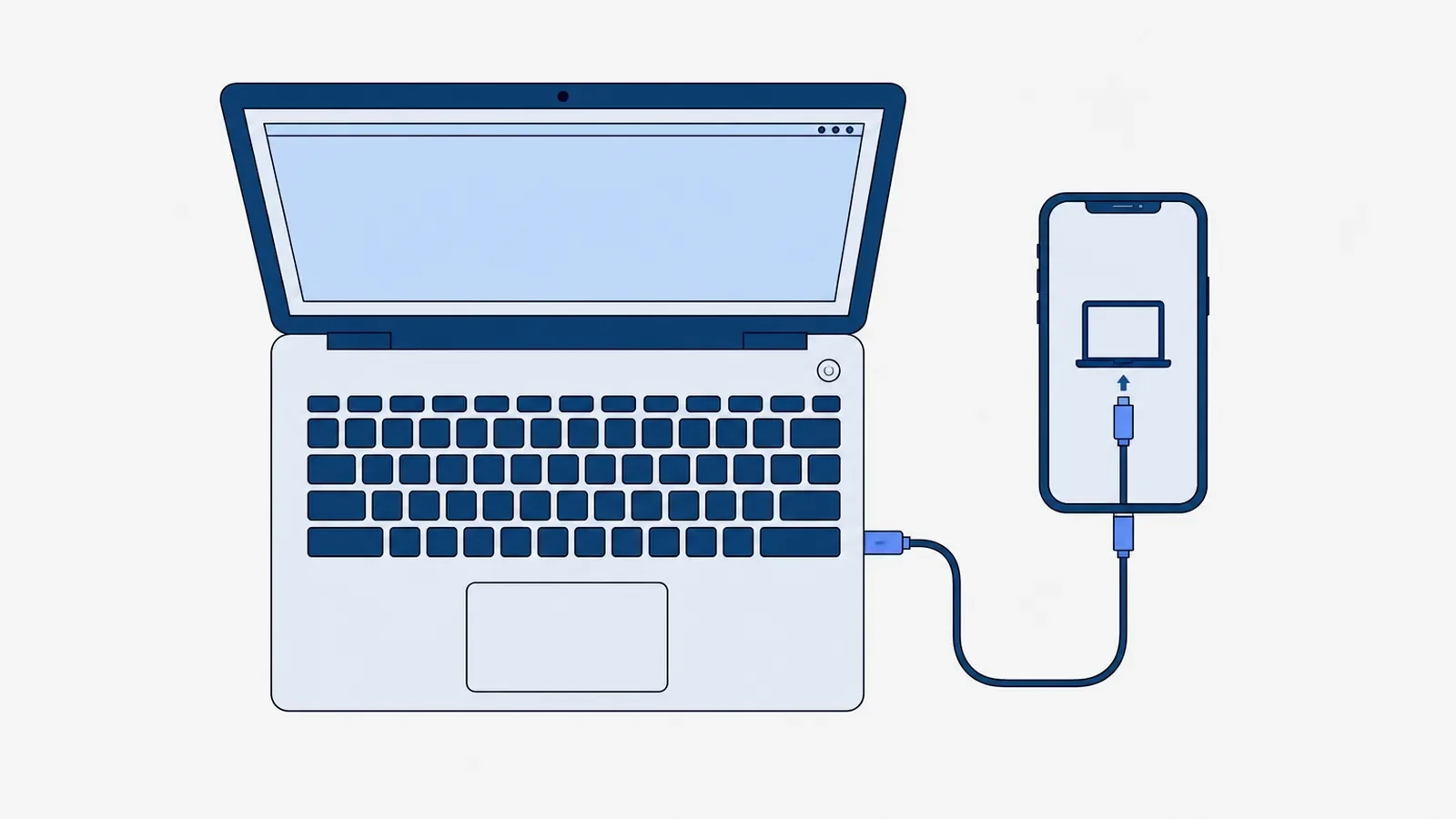 Smartfon podłączony kablem USB do otwartego laptopa, na ekranie telefonu ikona komputera i wtyczki kabla